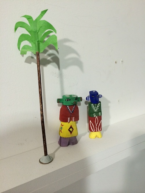 paper palm tree and figurines